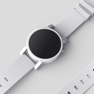 Eine Uhr mit schwarzem Zifferblatt und weißem Armband, die ein Alleinstellungsmerkmal darstellt.