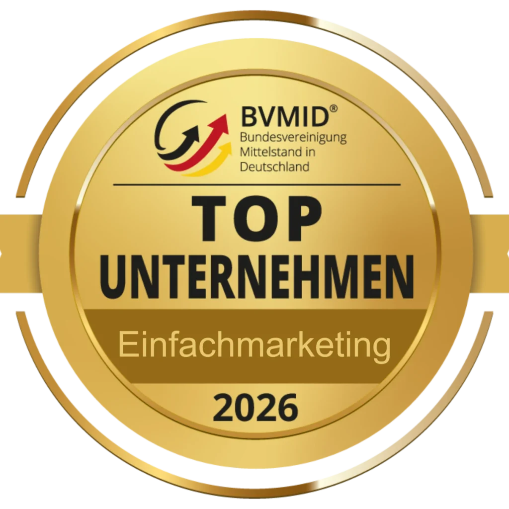 Ein runder, goldfarbener Anstecker mit der Aufschrift „BVMID Top Unternehmen 2026“, auf dem in der Mitte „Einfachmarketing“ und darüber das BVMID-Logo zu sehen ist, was die Anerkennung von Einfachmarketing unter den führenden Unternehmen unterstreicht.